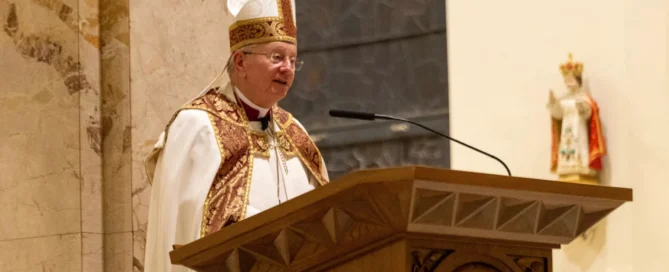 Bishop Ricken at Adele Brice Vespers reading from pulpit
